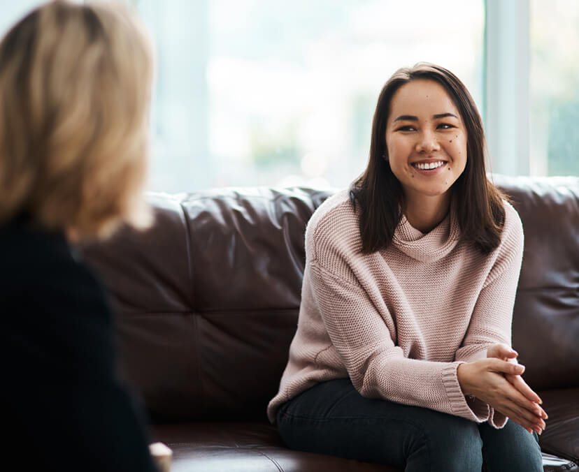 Girl sitting talking to someone