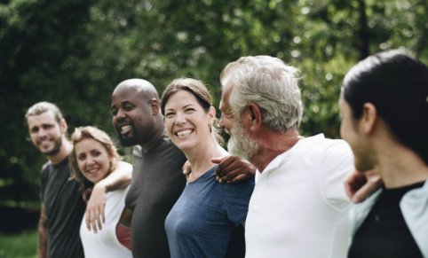 Group of people with arms around each other